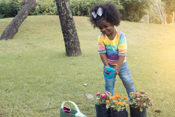 African girl is playing in the garden