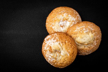 Cottage cheese (cheesecake) cookies on black background.