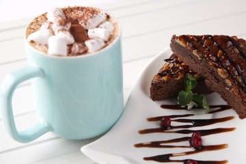 small sweet marshmallows with cocoa and chocolate cake