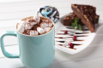 small sweet marshmallows with cocoa and chocolate cake