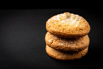 Cottage cheese (cheesecake) cookies on black background.