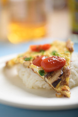 Minced pork omelette and rice on a paper plate to save the world