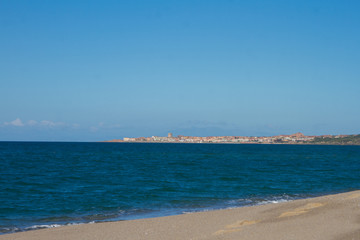 beautiful panorama of the famous beaches of the Sardinian sea with the isola rossa and castelsardo  behind