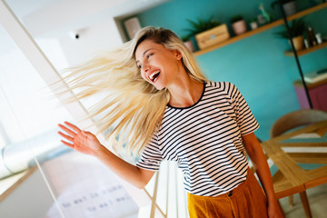 Portrait of beautiful young happy woman smiling and having fun