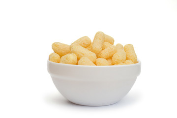 Corn sticks in a plate on a white background.