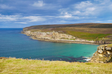Coastline in Caithness, Scotland, UK on a calm, sunny day at the end of summer, showing the rock...