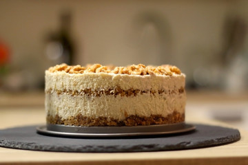 Vegan cake with walnuts, cashew nuts and raisins. Selective focus.