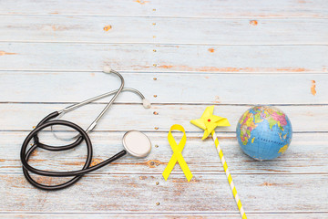Yellow ribbon for world childhood cancer day - Support for the fight against cancer
