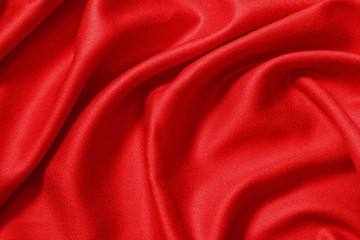 Fototapeta na wymiar Red cloth waves background texture.