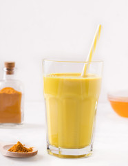 indian drink golden milk next to ingredients