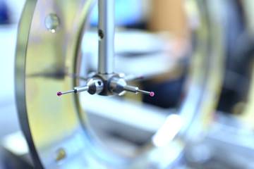 closeup of a laser for quality control in mechanical engineering of an industrial company