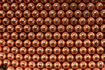 Macro Copper and steel ball bearings in repeating pattern 3