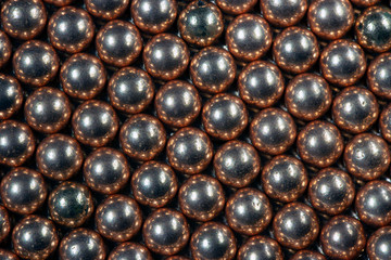 Macro Copper and steel ball bearings in repeating pattern 2