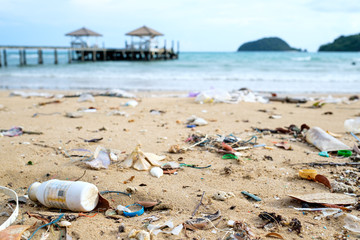 Fototapeta na wymiar Beach in Thailand ruined by heavy plastic pollution