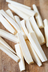 pieces of parsnip on wooden surface