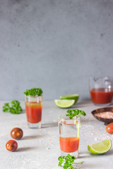 Bloody Mary cocktail and ingredients, copy space. Classic tomato cocktail with vodka. 