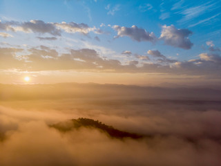Fototapeta na wymiar Aerial view forest in morning fog mist, breathing mountains, Sunshine on The Morning Mist
