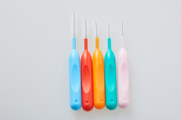 Brushes for braces, toothbrushes for interdental spaces on white background. Close up. Macro. The...