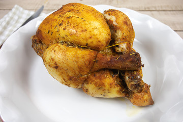 whole roast chicken in a dish