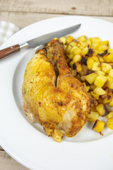 roasted chicken leg and hash browns