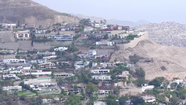  Aerial view of the rich neighborhood of Casuririnas and the poor neighborhood of Pamplona, ​​in Lima, Peru.