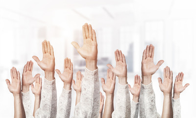Row of man hands showing voting gesture