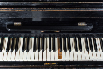Fototapeta na wymiar Piano keyboard background selective focus white black