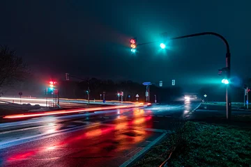 Foto op Plexiglas traffic lights in the city at night © Anselm