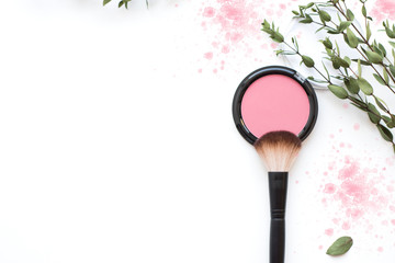 Rouge pink on white background and makeup brush. 