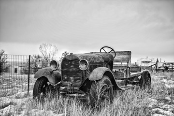 Vintage truck abandoned in a field.