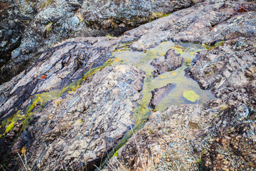  waterfall flowing through big rocks