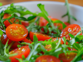 Healthy salad with cherry tomatoes and rucola, close-up