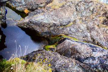  waterfall flowing through big rocks