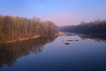 Fototapeta premium Sunrise on a cold winter morning on the river 