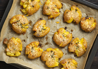Crispy smashed potatoes roasted with garlic and parmesan. 