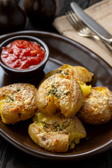 Crispy smashed potatoes roasted with garlic and parmesan. 