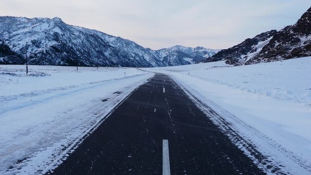 snow drifting snow on the highway in the mountains