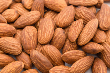 Close up peeled almond nut, almond background texture. healthy food and snack concept.