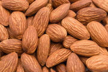 Close up peeled almond nut, almond background texture. healthy food and snack concept.
