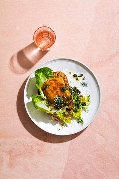 Overhead view of cod fish served on plate