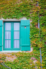 Fototapeta na wymiar Giverny. France. Claude Monet's Garden. Window of Claude Monet's house