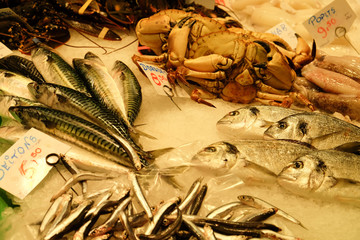 Fish an crabs  for sale at food market in Barcelona Spain