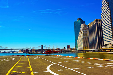 Helicopter landing at helipad. Skyline with Skyscrapers in Lower Manhattan, New York City, America USA. American architecture building. Metropolis NYC. Cityscape. Hudson, East River NY © Roman Babakin
