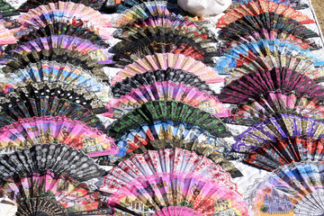 Colourful Fans Spread out in Overlapping Pattern 
