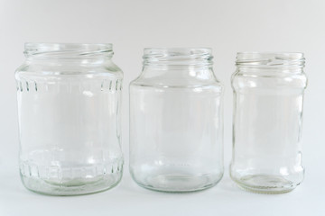 Glass jars at gray monochrome background. Zero waste concept.