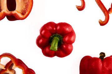 Collage set of fresh whole and sliced red bell pepper (paprika) isolated on a white background. Top view