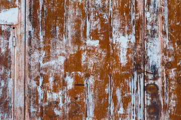 rusted metal surface with white patches
