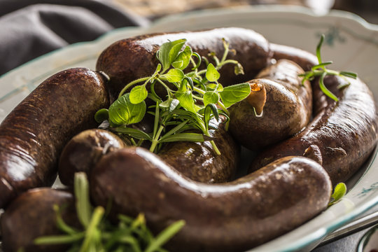 Roasted sausages in pan with rosemary. Traditional european food bratwurst jaternice or jitrnice