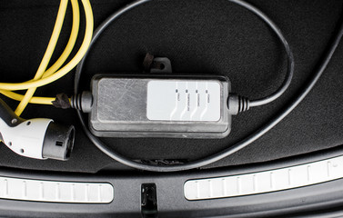 electric car lead in the trunk of a car
