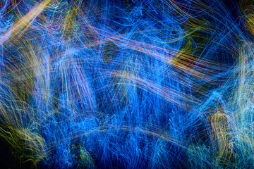 defocused luminous colored stripes, abstract chaotic interlacing of lines